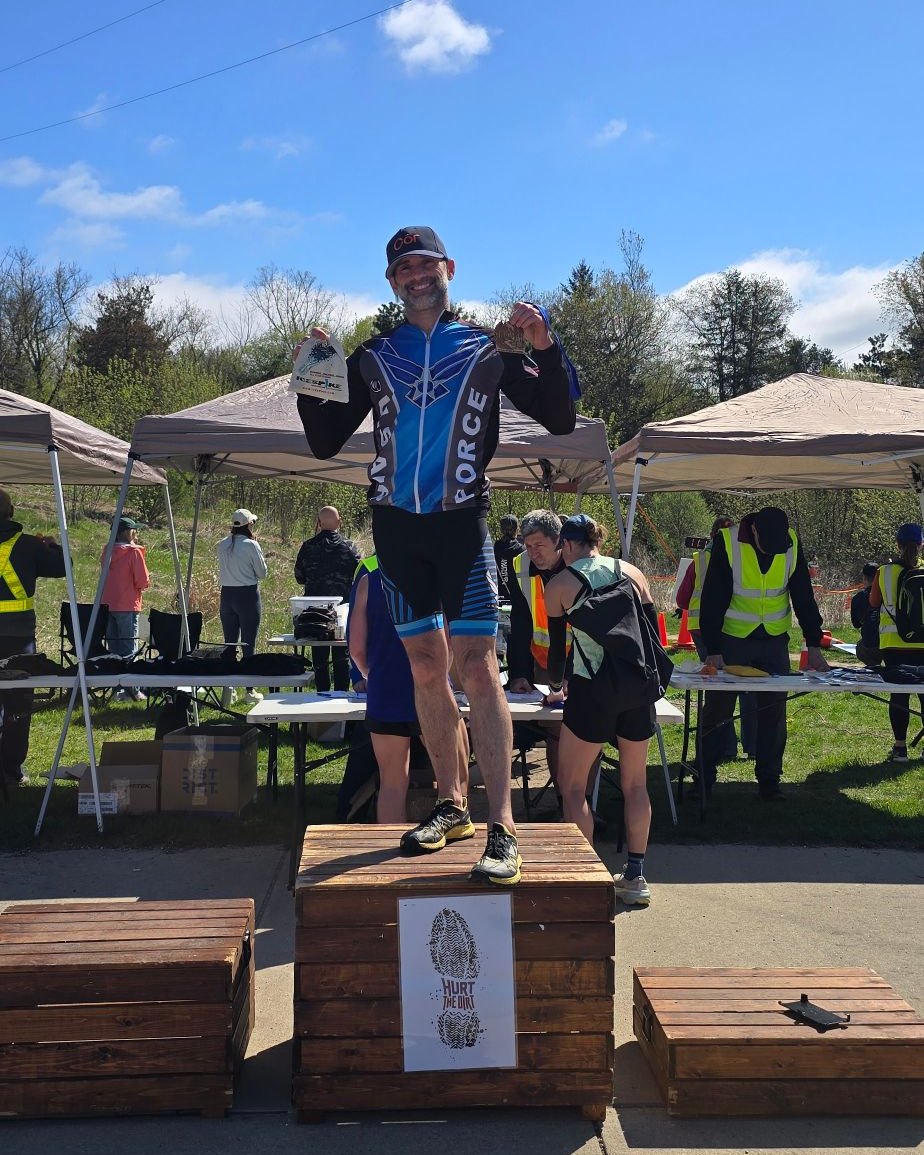 Ken on the top step of the Hurt the Dirt podium in an Air Force kit